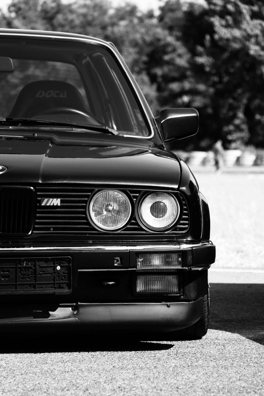 a black and white photo of a bmw