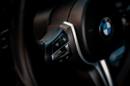 a close up of a steering wheel of a car